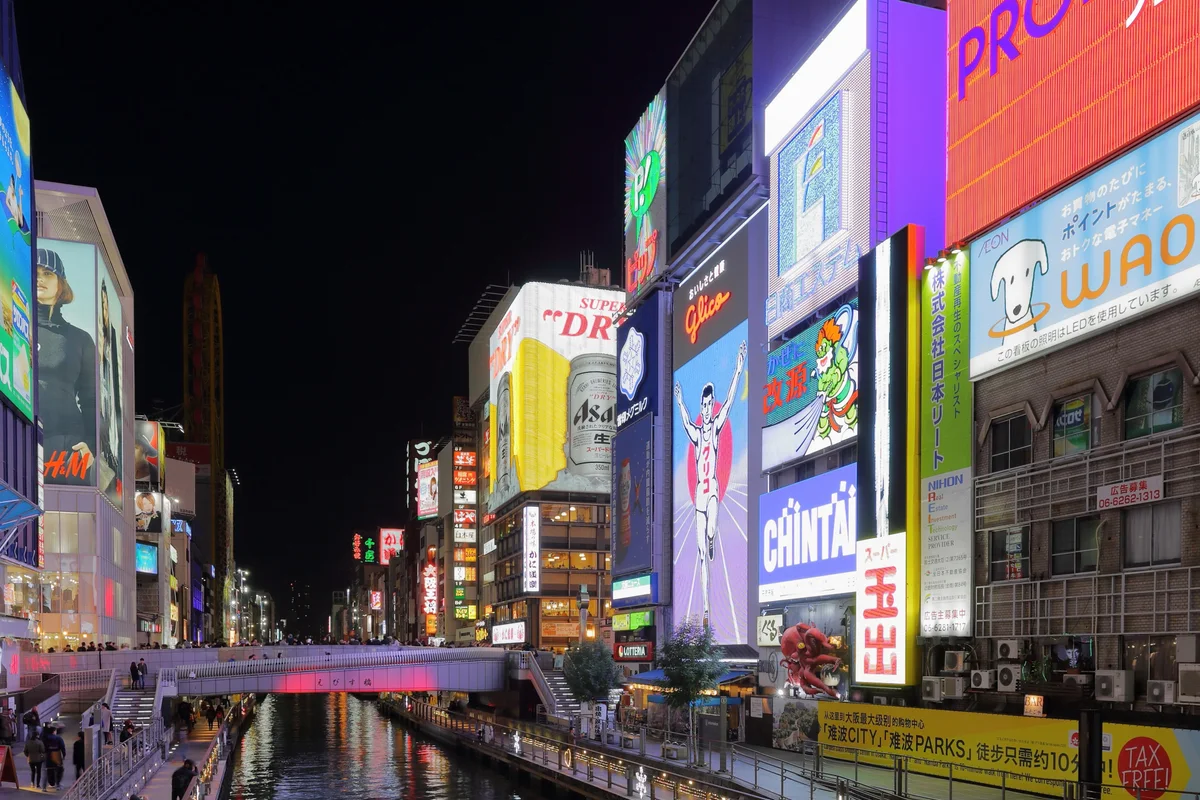 Neon signs along the Dotonbori canal at night
